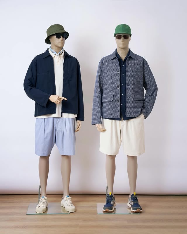 Shorts and shirts for spring. Left or right?⁠⁠Left: ⁠– Olive Recycled Polytech beach hat⁠– Ecru Cambric neckerchief⁠– Ecru Light Weight Terry Newlyn polo⁠– Navy Seo Recycled Nylon Zip Too shirt⁠– Navy Kennedy Stripe Pleated Track short⁠– Novesta for Universal Works Ecru/Pale Blue Canvas Star Master⁠⁠Right: ⁠– Green Canvas Baseball hat⁠– A. SOCIETY x Universal Works Silver/Grey Kowloon eyewear⁠– Navy Arten Seersucker Road shirt⁠– Navy Konos Cotton Warmus jacket⁠– Ecru Slub Drill Pleated Track short⁠⁠#UniversalWorks #SS26