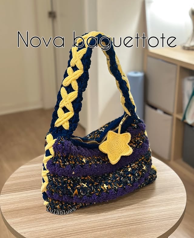 Another month, another commission done ⭐️This time, it’s my bestselling bag pattern of the year, the Nova Baguettote. My commission style is a little different from the pattern I released because I love sharing extra creative ideas exclusively with my collectors.The original theme for this one was supposed to be a galaxy with an orange hue, but looking closely at it, it reminds me of a sky filled with lanterns ✨ Everything is hand sewn, including the lining ❤️ new update: I am opening up 1-2 more slots for this style tonight on my site ❤️#crochet #crochetplushies #crochetbags #amigurumi by @lulabluesbyangell
