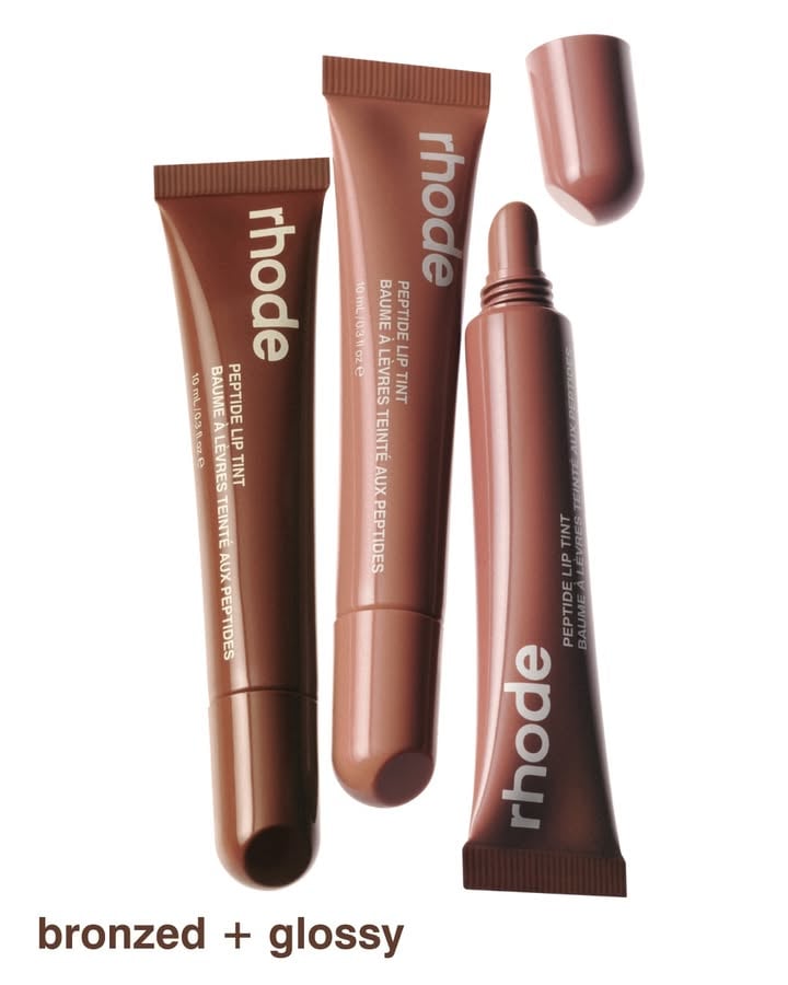 bronzed + glossy 🥥🥭​
​
get to know the limited edition summer peptide lip tints. each sun-warmed, bronzy shade melts onto lips with a hint of tint and a nostalgic summer scent. throw them in your terry bag or pop one in your lip case to hydrate, nourish, and replenish on the go.​
​
pair with the new core peptide lip shapes in push, squeeze, and jump for a summery lip combo that feels glossy and lived-in. ​
​
see you june 9th at 9am PT. only on rhodeskin.com 🤎​